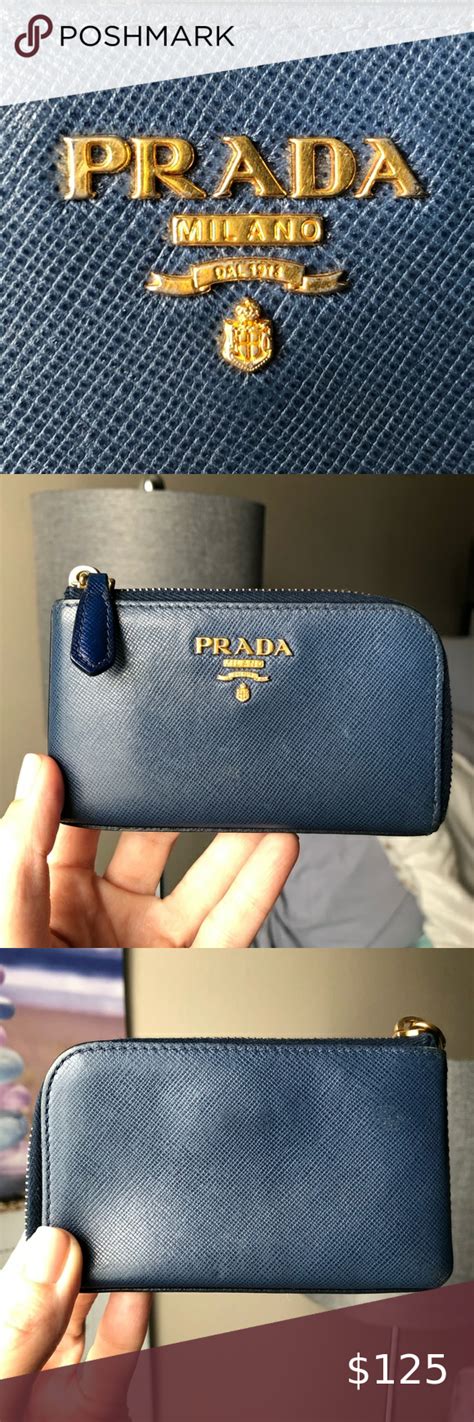 prada coin purse with strap.